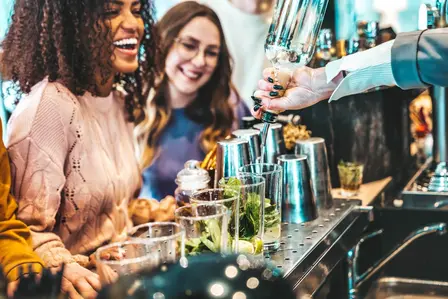 Neabara bartender expertly pouring a drink at an event