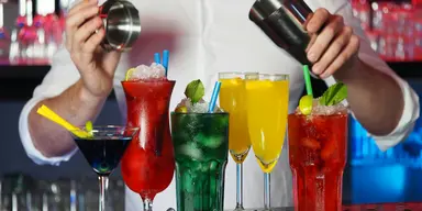 Professional bartender elegantly serving champagne at a St. Louis wedding reception
